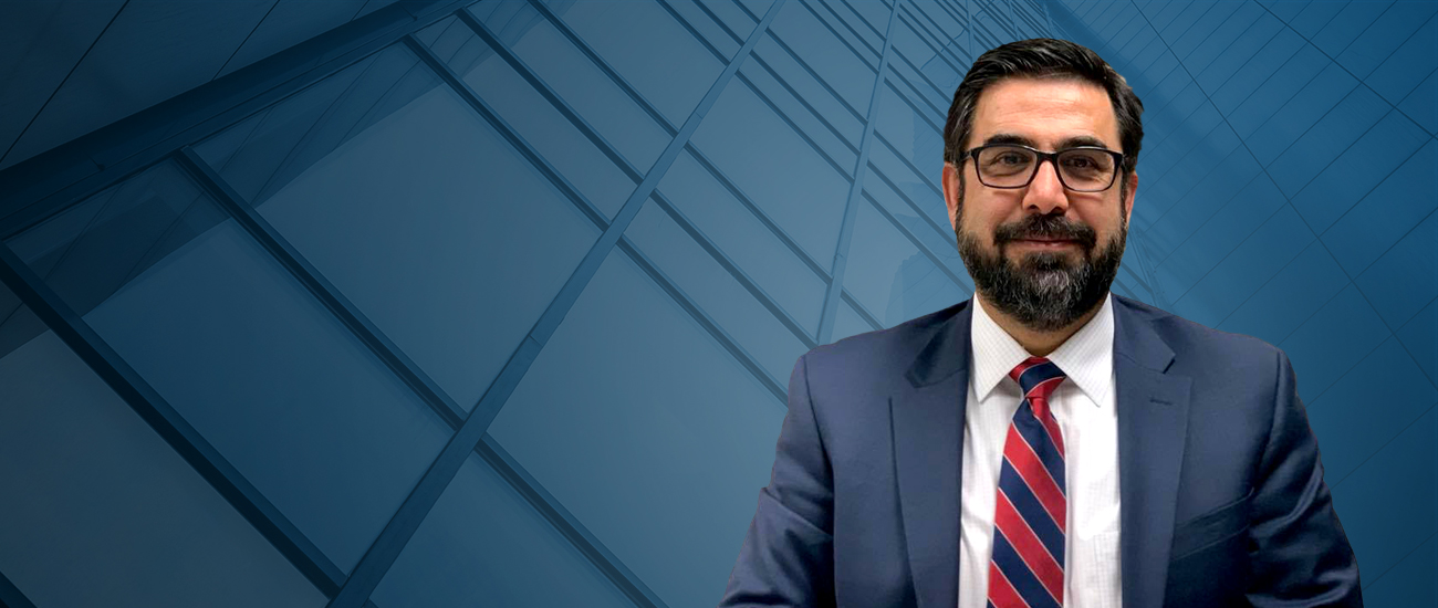 Attorney Shafeek Seddiq with a building structure in the background